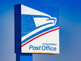 The USPS sign at a post office