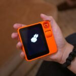 Say Hello to Rabbit R1: A Tiny Orange Box That Trades Phone Apps for AI
